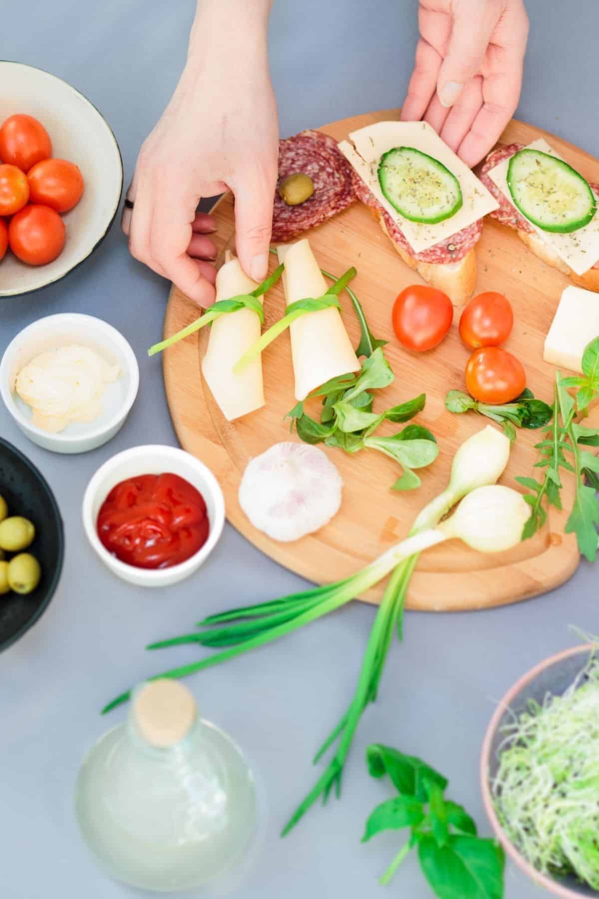 woman assembling a healthy snack tray.