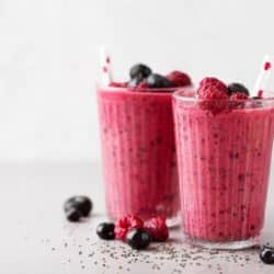 pink berry smoothie in two glasses