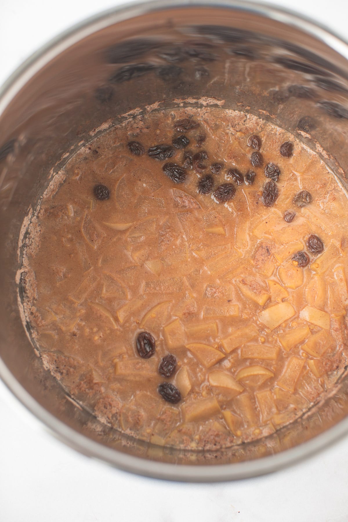 cooked instant pot steel cut oats in a stainless steel pressure cooker pot.