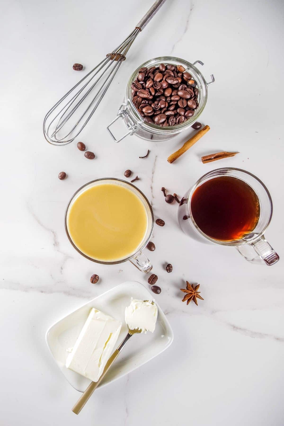 ingredients for butter coffee on a marble kitchen countertop.