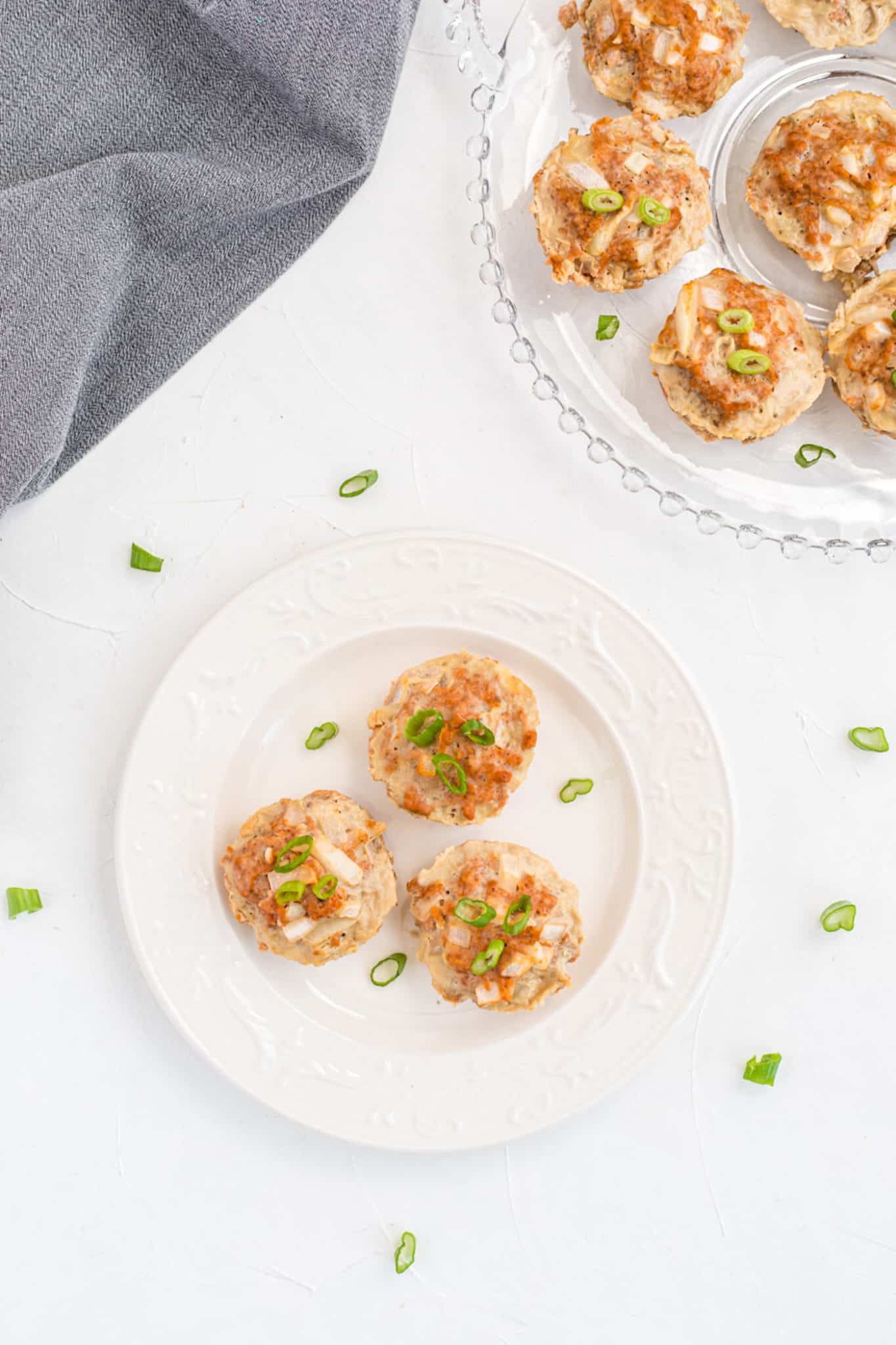 turkey meatloaf muffins on a pretty serving tray on a table.