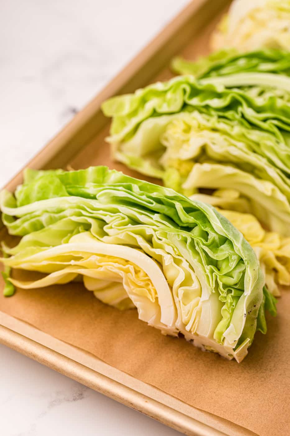 frozen cabbage slices on baking sheet.