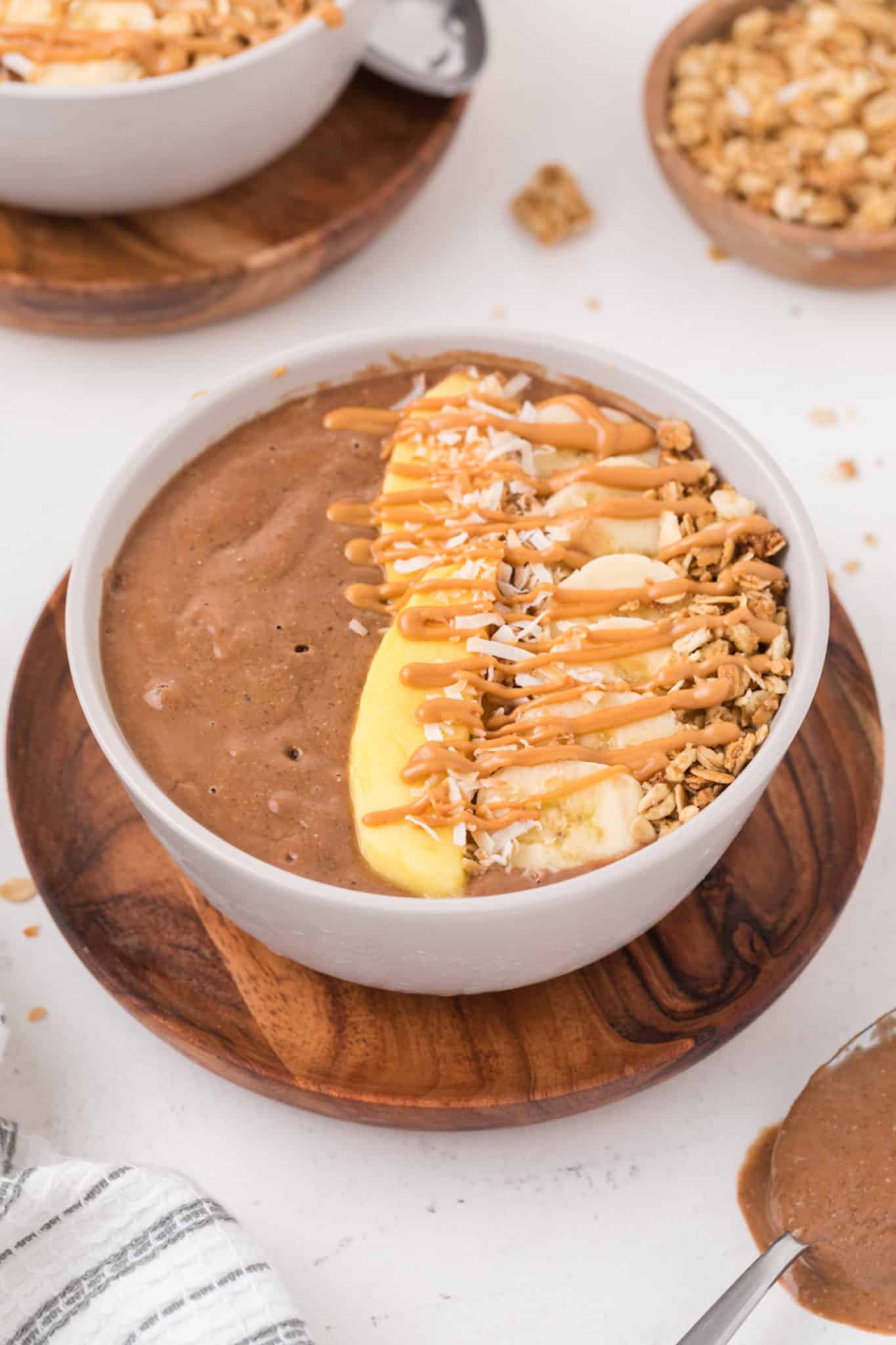 chocolate smoothie bowl with fresh fruit on top.