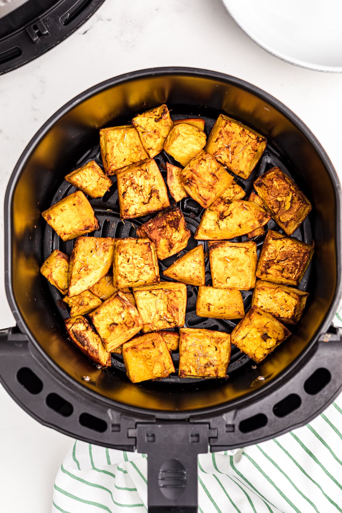 roasted pumpkin chunks in an air fryer.