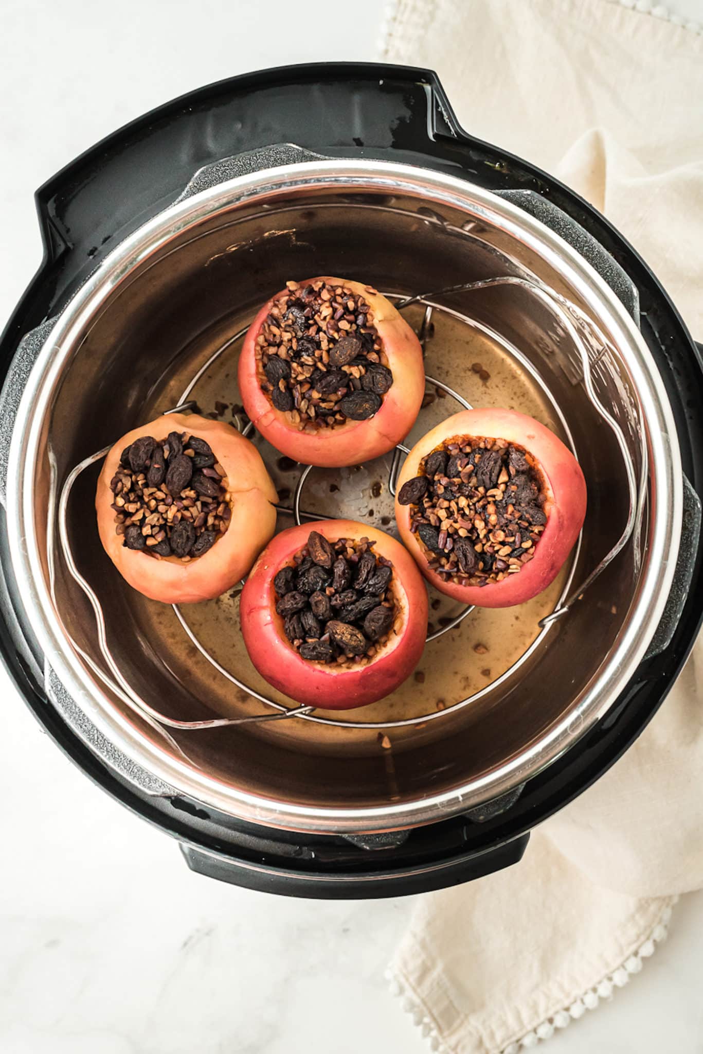 baked apples inside of the instant pot pressure cooker.