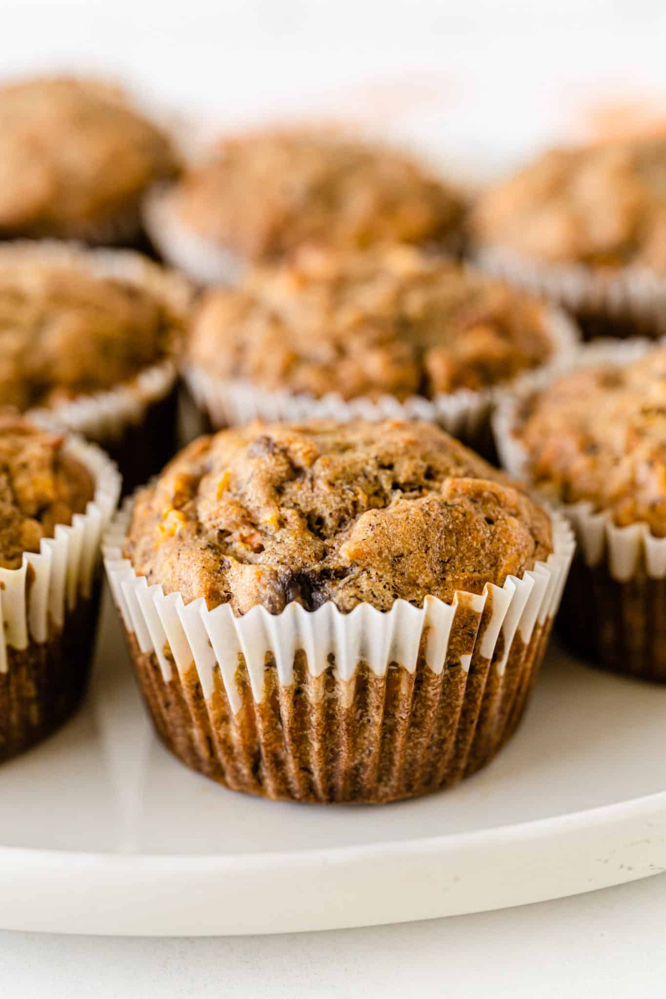 banana carrot muffins served on a plate.