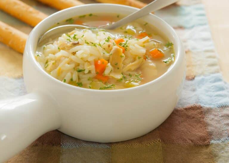 bowl of instant pot chicken rice veggie soup.