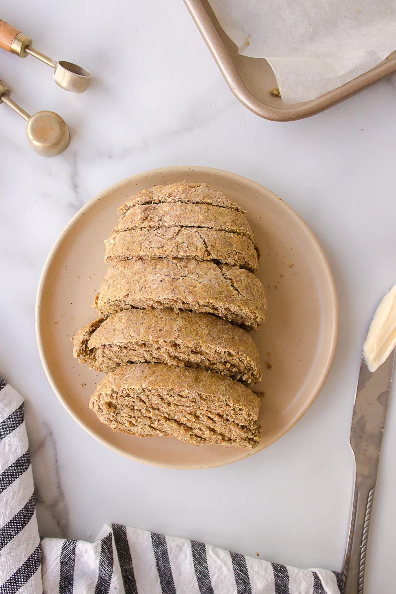 sliced gluten free buckwheat bread on a plate.