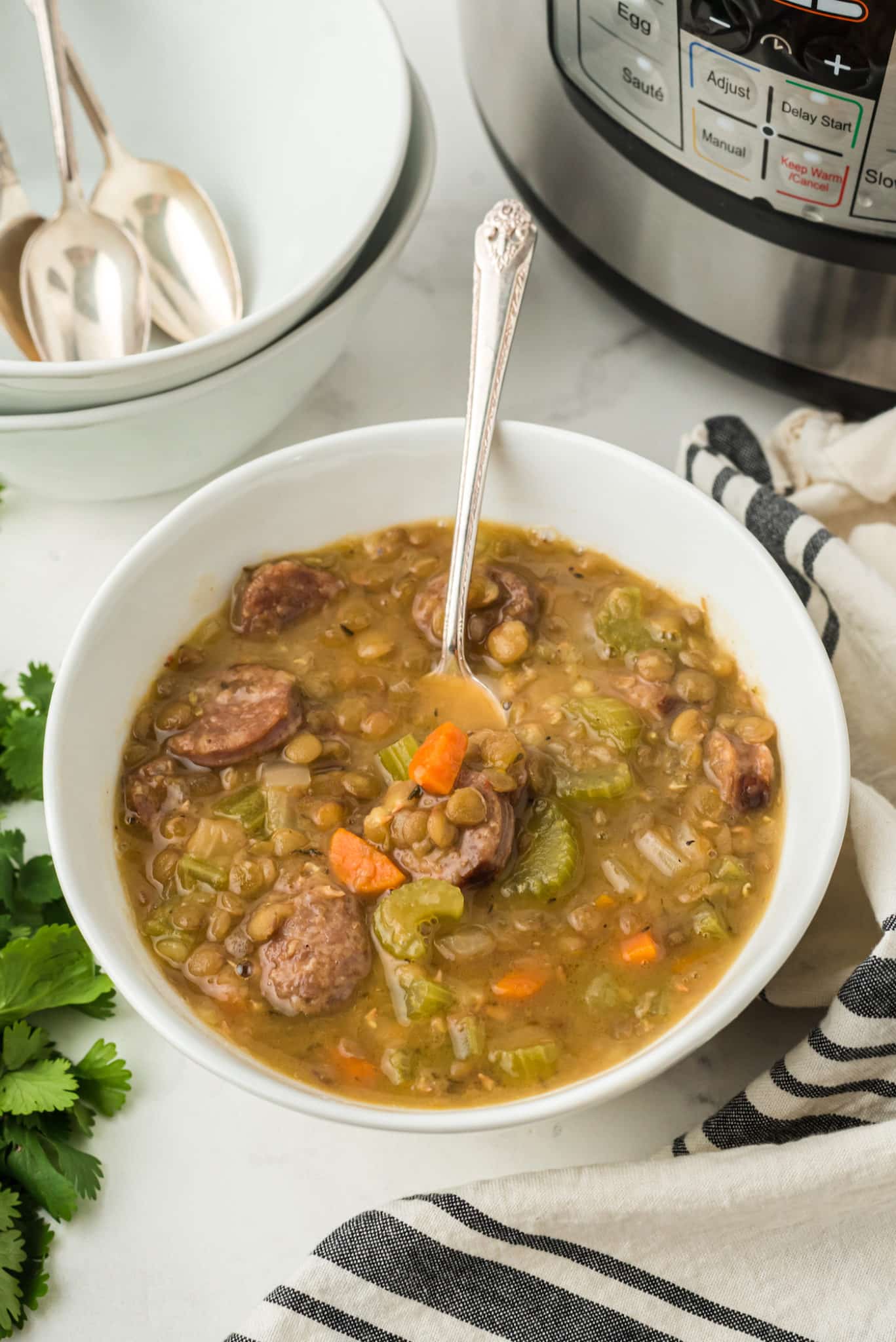 bowl of instant pot lentil soup with sausage.