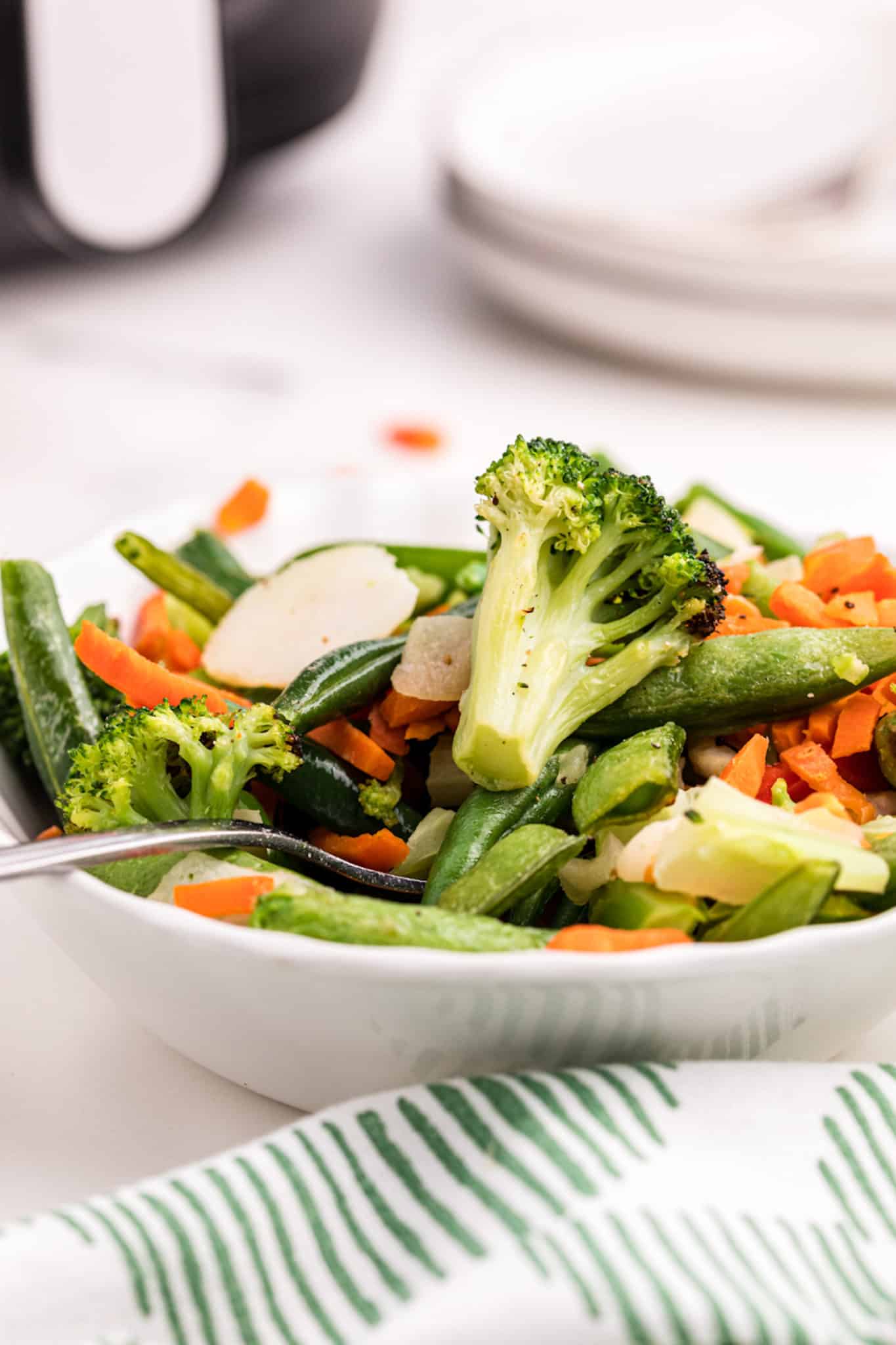 a bowl of cooked air fried stir fry vegetables.