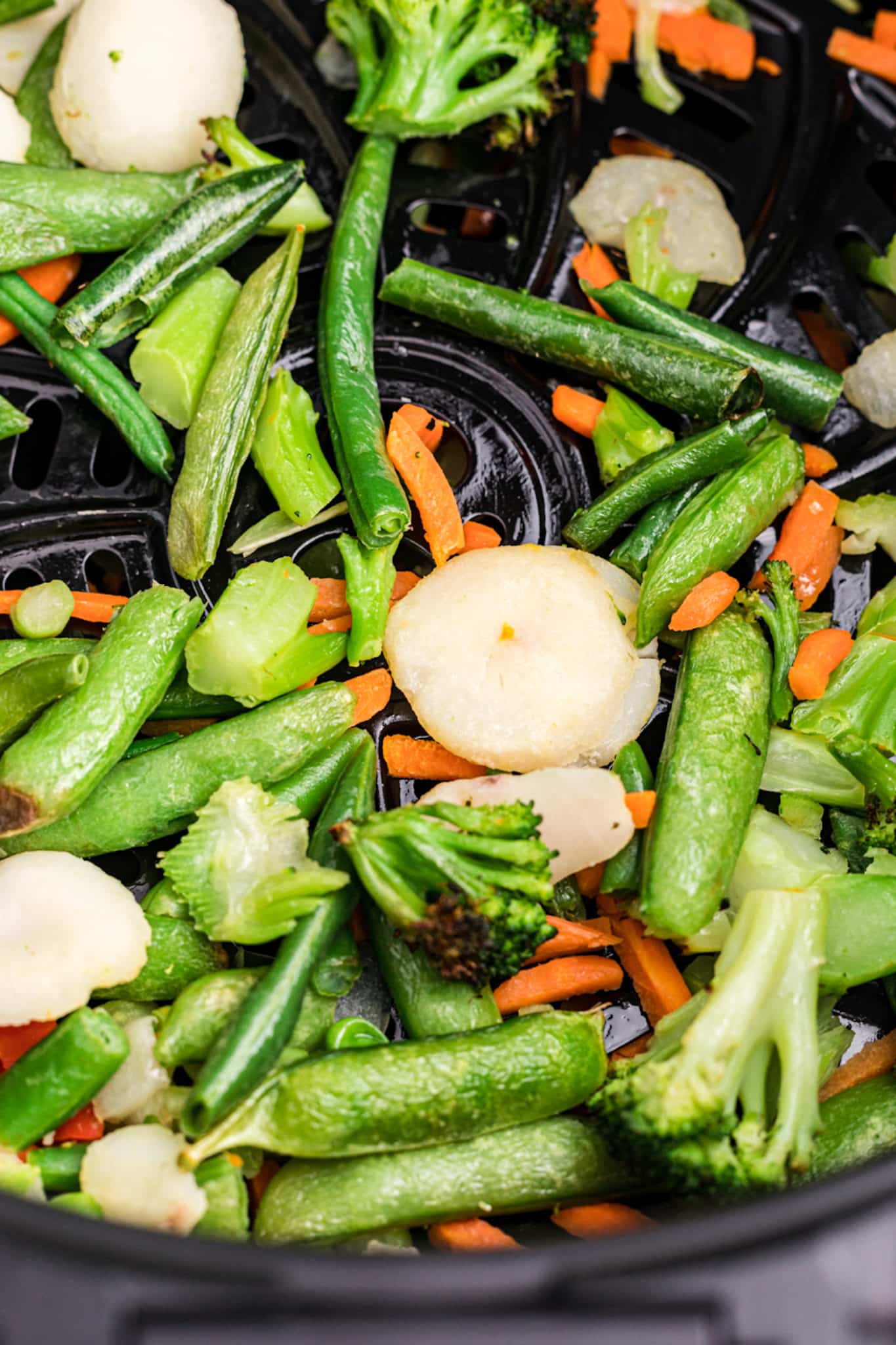 air fryer frozen vegetables in the basket.