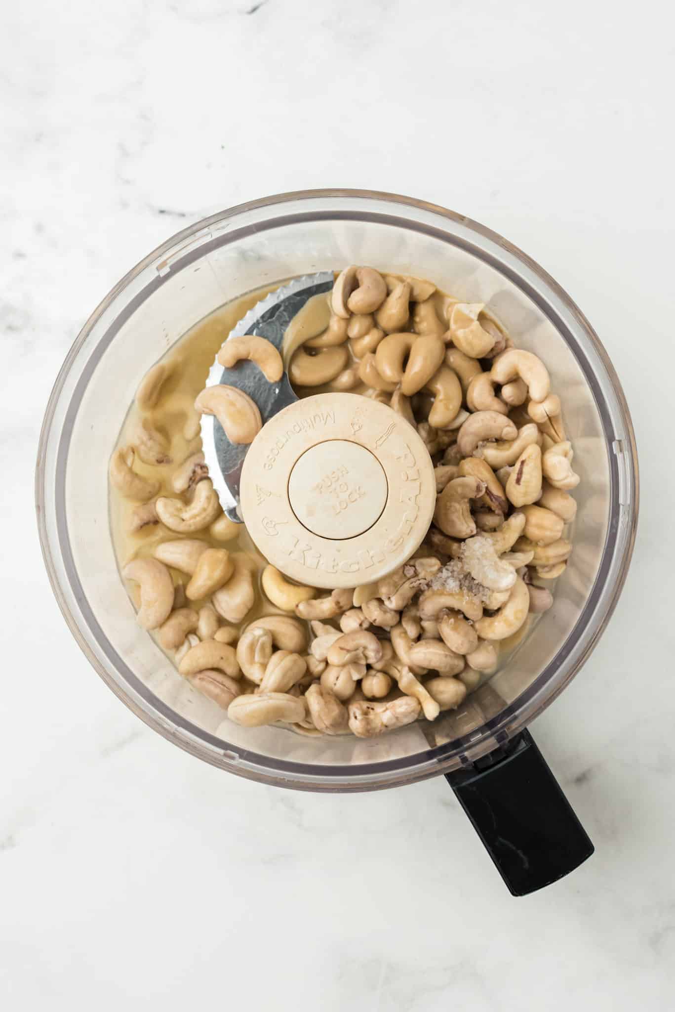 ingredients for cashew hummus in food processor.