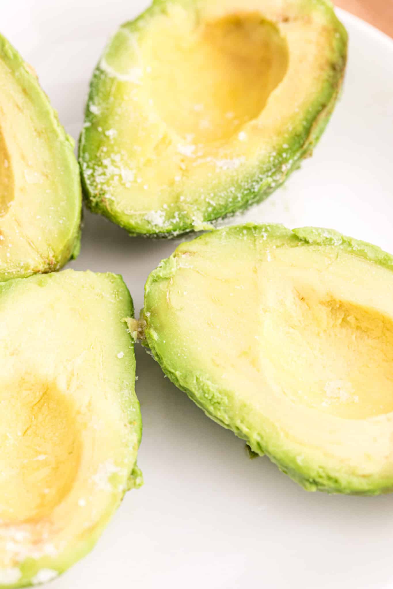 frozen avocados on a plate.