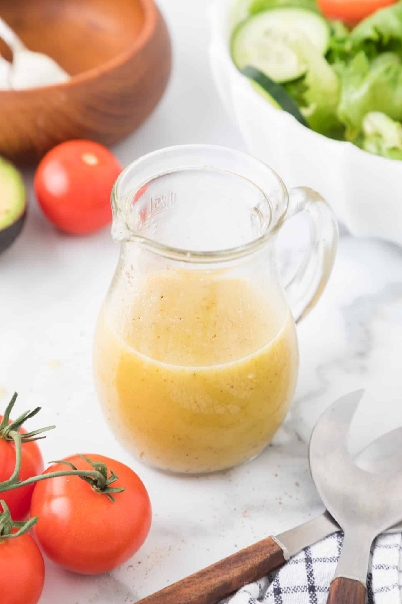 honey mustard dressing in a jar on a table.