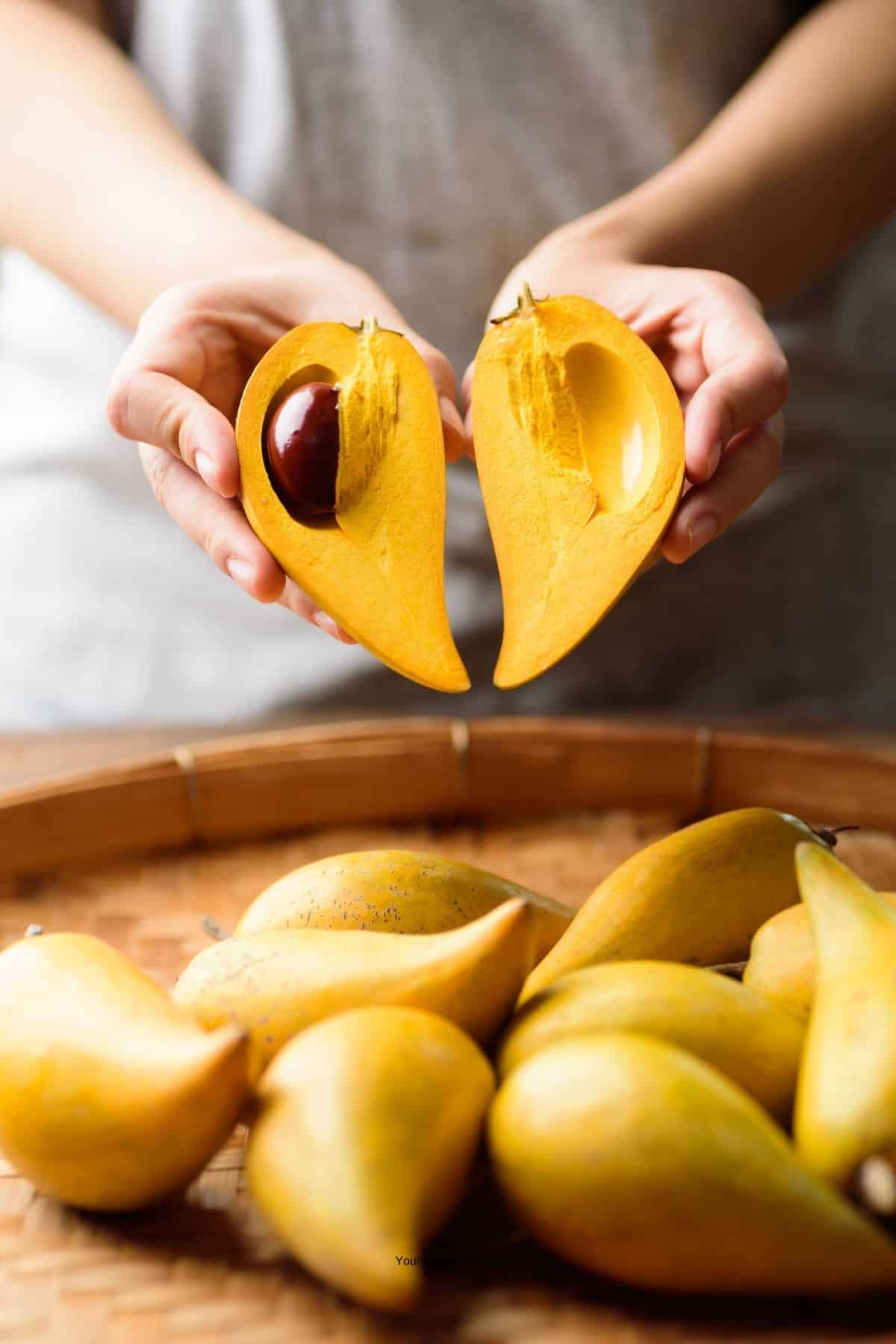 eggfruit cut in half to show inside.