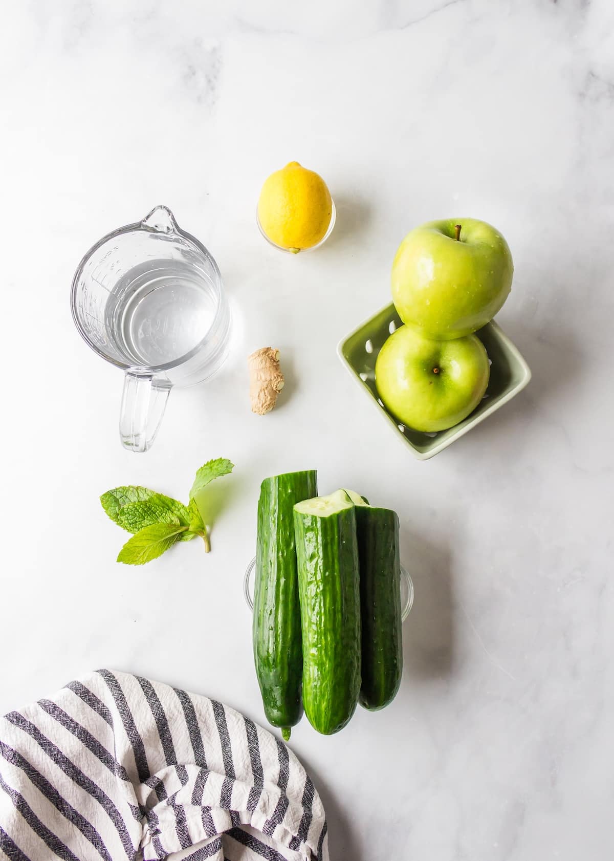 ingredients for cucumber juice on table.