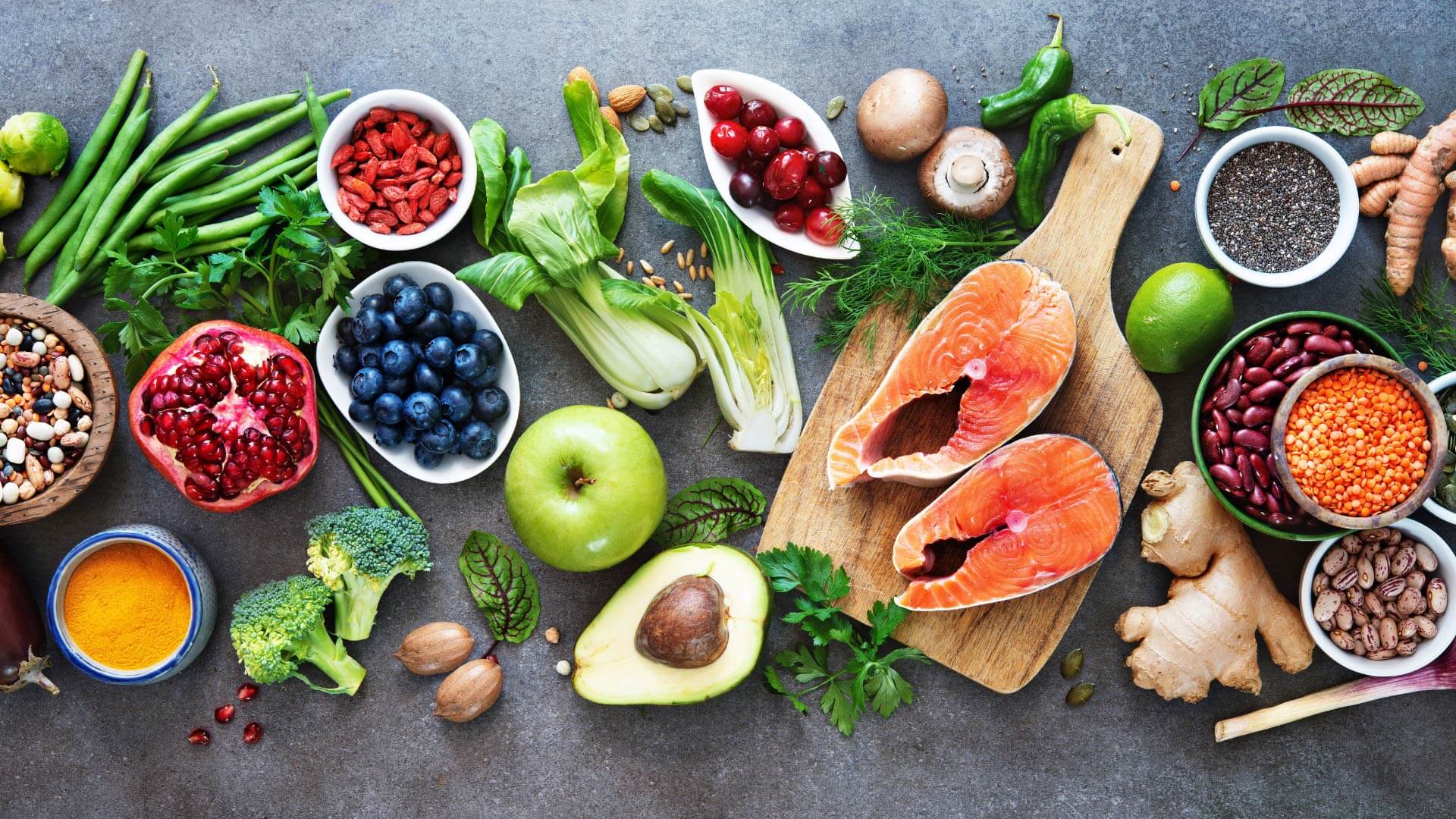 Flay lay of clean eating foods on a gray background