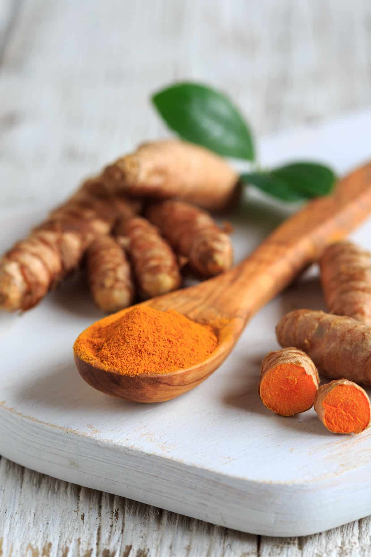 turmeric root on a cutting board.