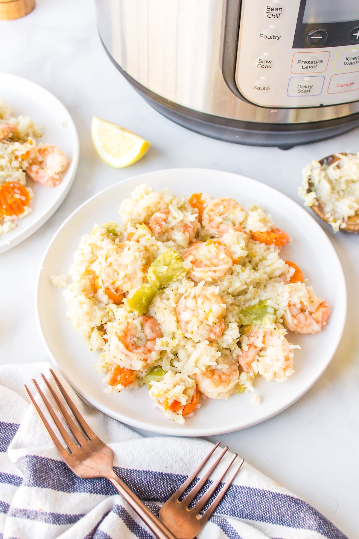 Instant Pot Rice and Shrimp on a white dinner plate.