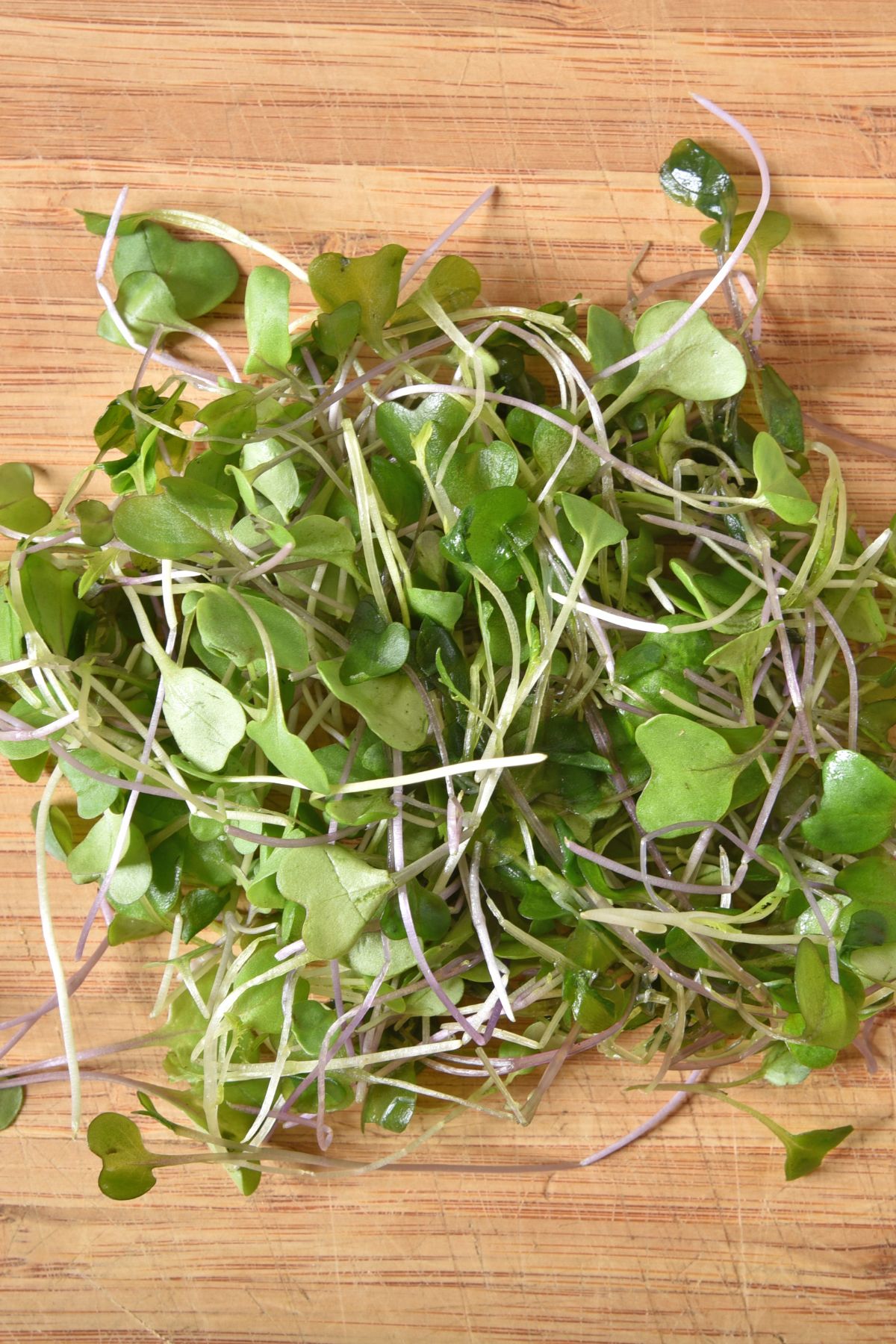 microgreens on cutting board.