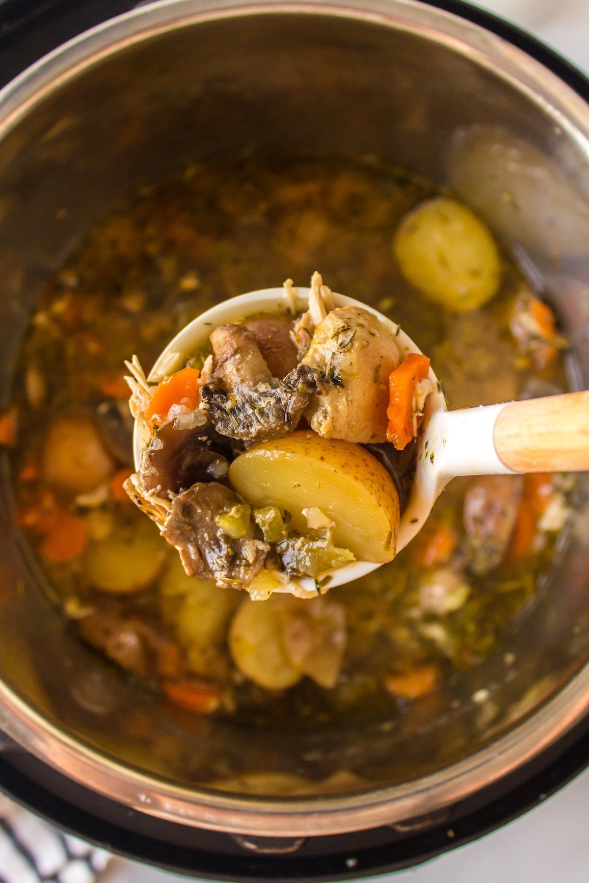 chicken soup with potatoes serving.