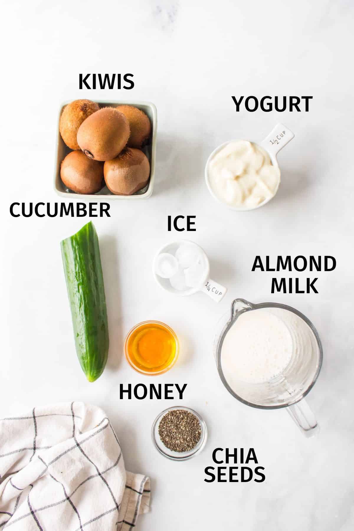 ingredients needed for a kiwi smoothie on a counter.