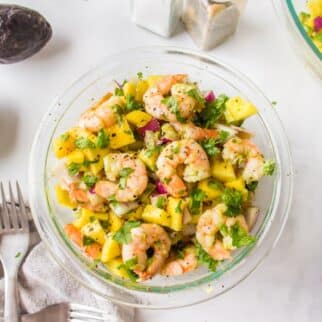 a bowl of avocado mango shrimp salad.