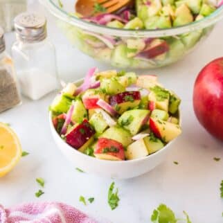 cucumber apple salad served in bowl.