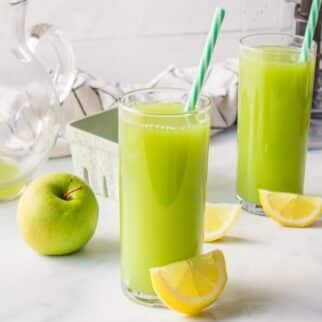 Cucumber Apple Juice with lemon wedge.