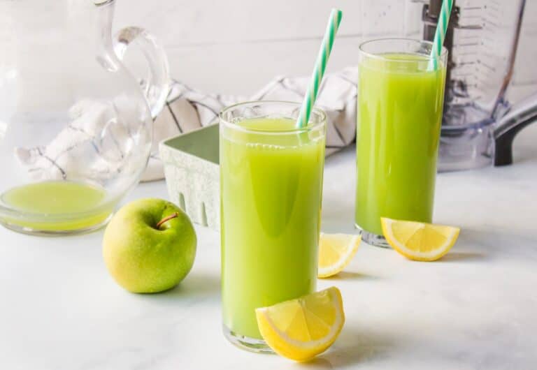 Cucumber Apple Juice with lemon wedge.