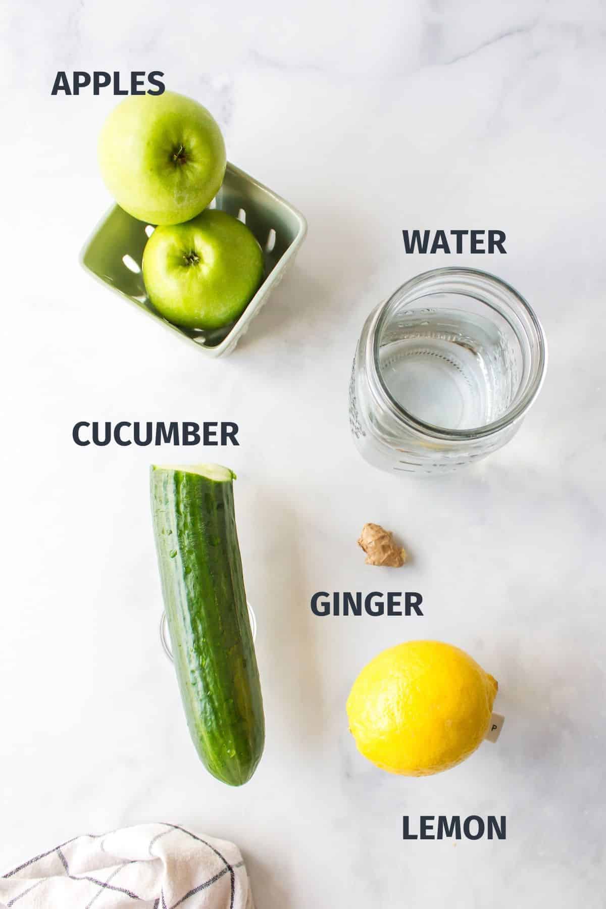 ingredients for making cucumber apple juice with labels