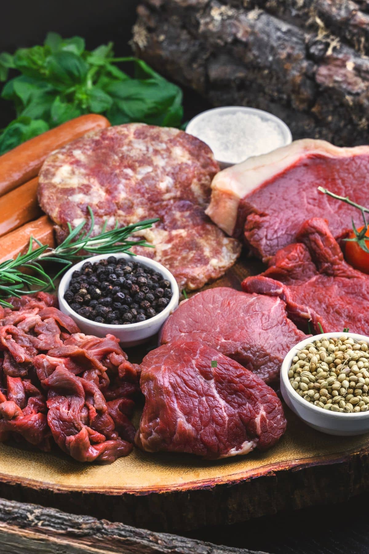 raw meats on table with spices.